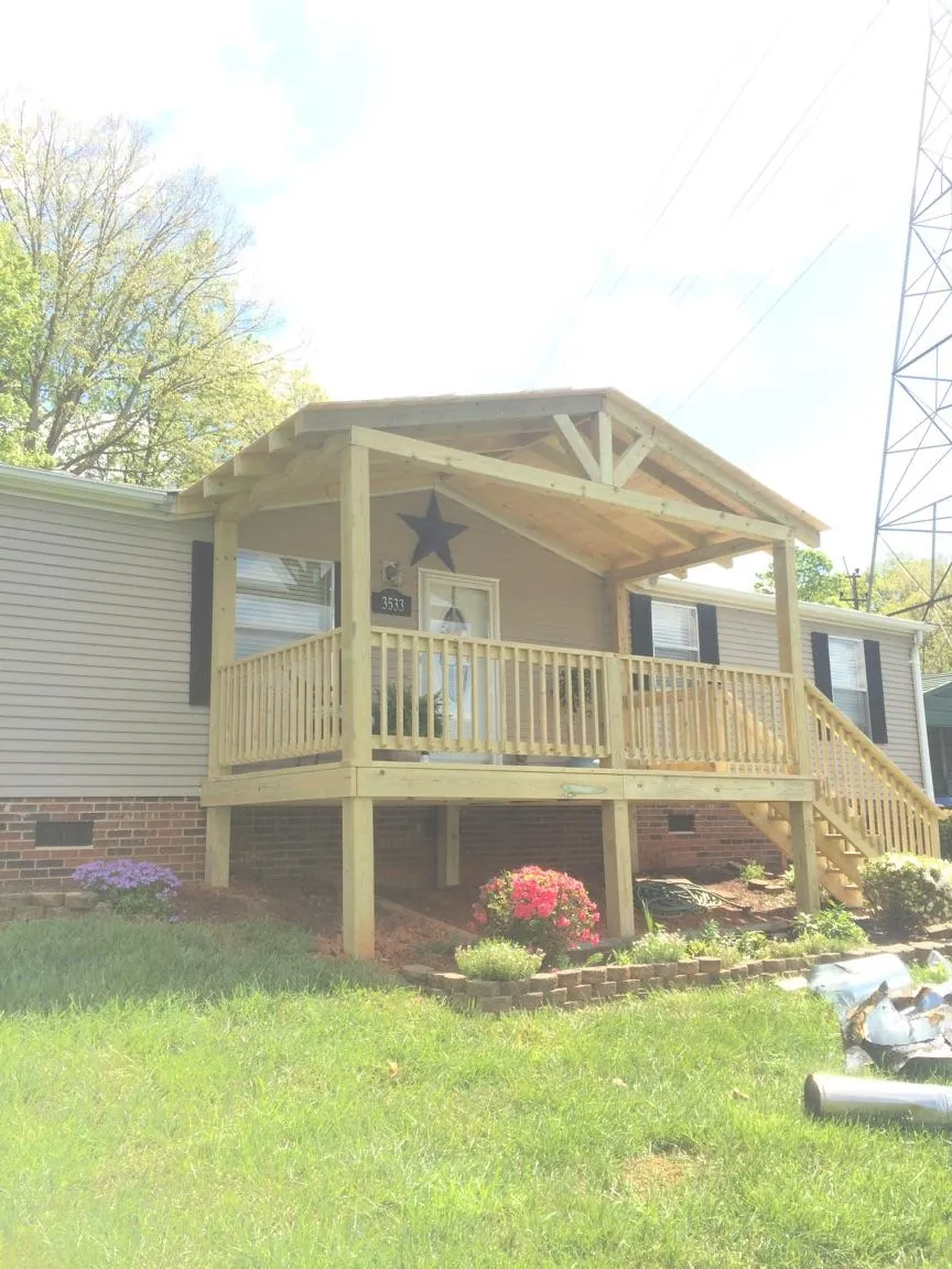 New gabled porch roof and deck railing added to a ranch home in Maple Shade